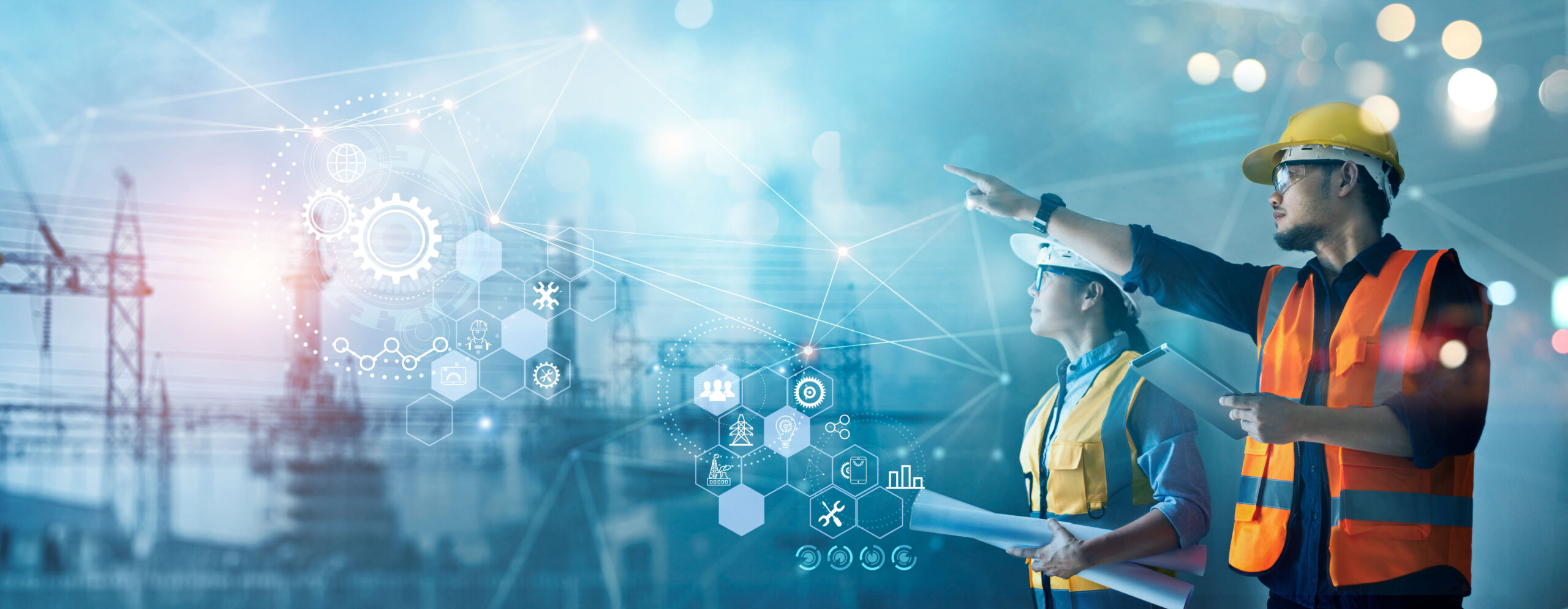 AdobeStock Male And Female Industrial Engineers Using Tablet Computer And Blueprints Checking And Analysis Data Of Power Plant Station Project On Network Background. See Less By Ipopba Scaled