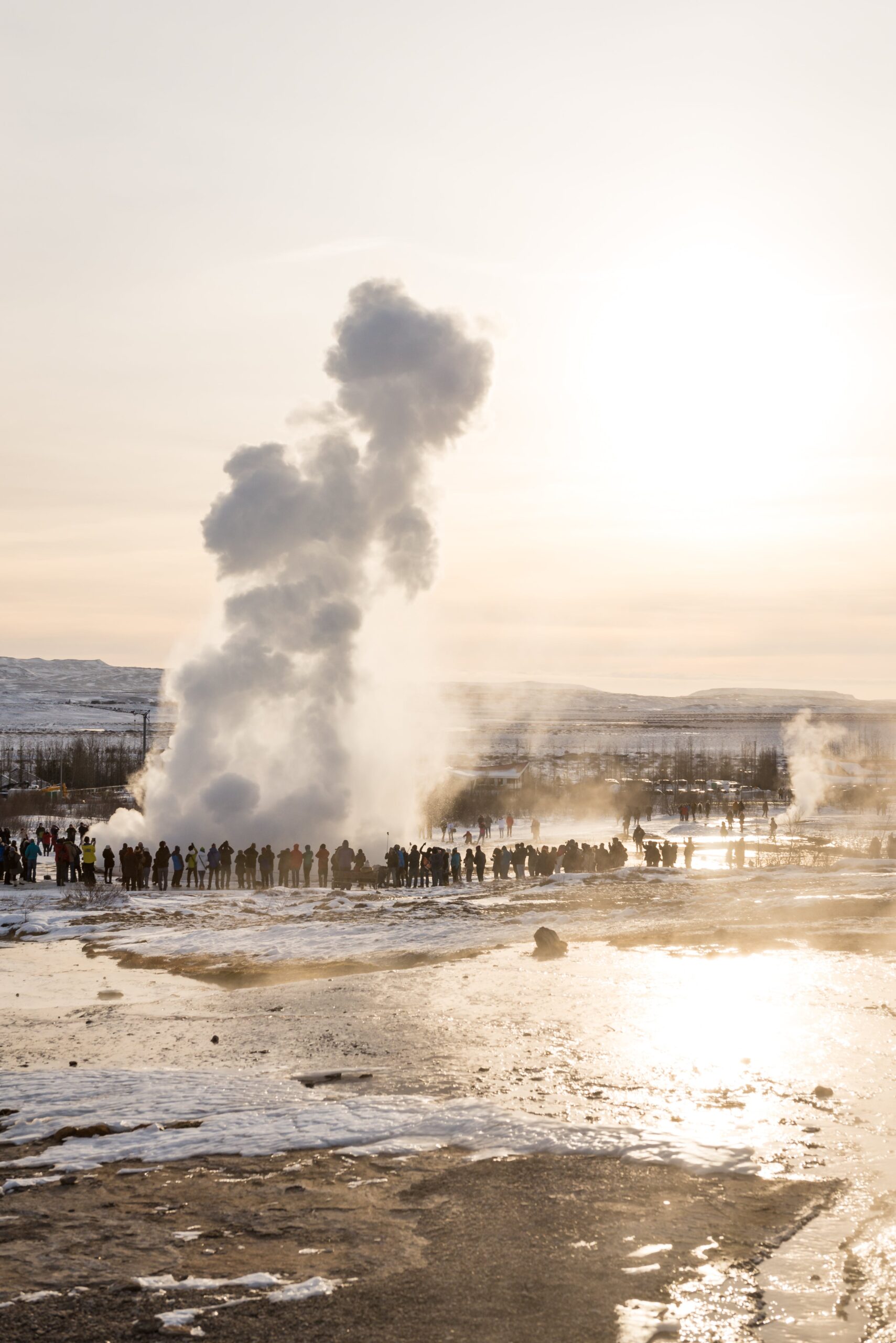 picture of steam rising from geothermal vents for article on geothermal energy