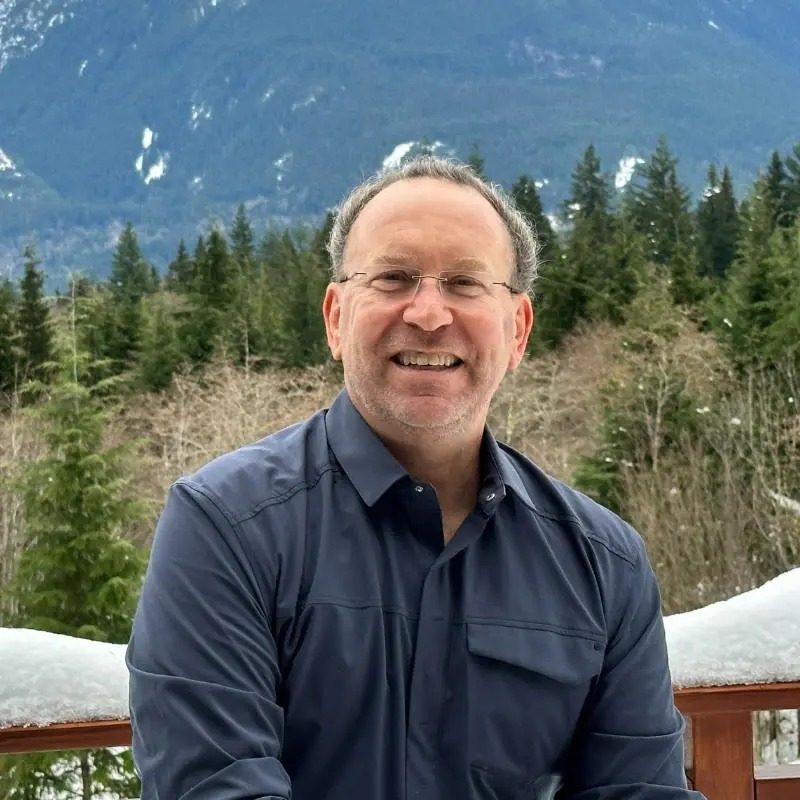 What a Leaner Oilfield Workforce Means for the Next Boom Man smiles outdoors winter mountains